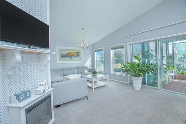 carpeted living room featuring high vaulted ceiling and a notable chandelier