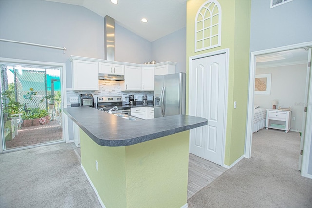 kitchen featuring light carpet, appliances with stainless steel finishes, kitchen peninsula, high vaulted ceiling, and white cabinetry