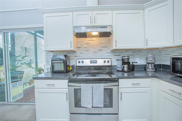 kitchen featuring white cabinets, decorative backsplash, and stainless steel appliances