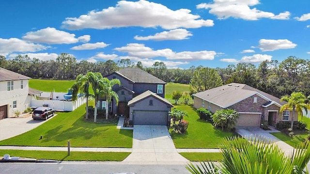 view of front of property featuring a garage and a front lawn