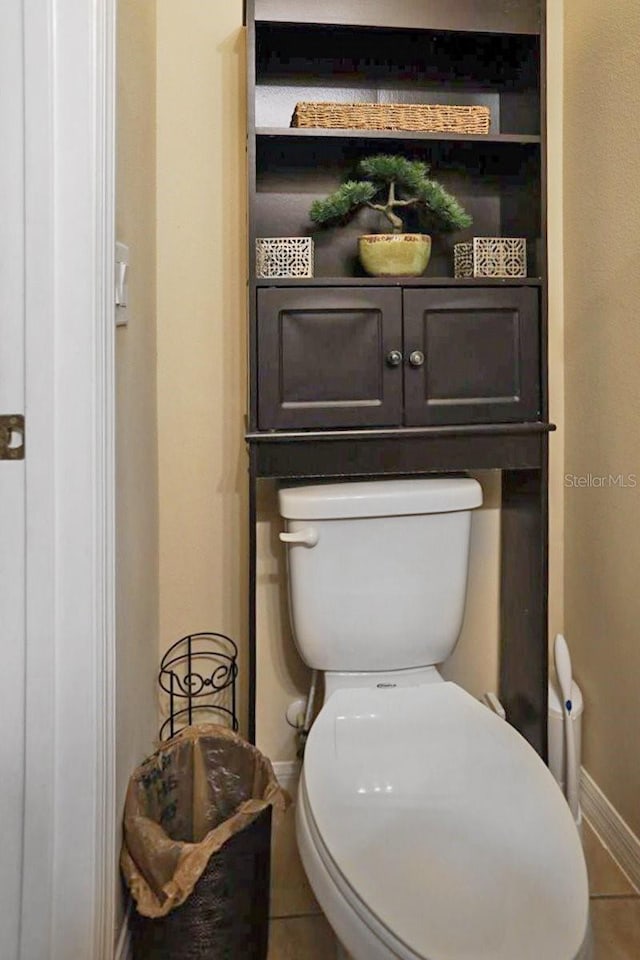 bathroom featuring tile patterned floors and toilet