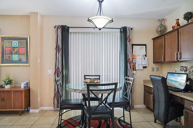 dining area featuring light tile patterned floors