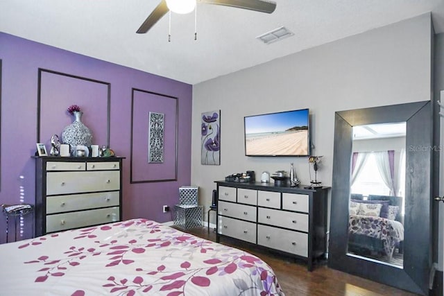 bedroom featuring ceiling fan and dark hardwood / wood-style flooring