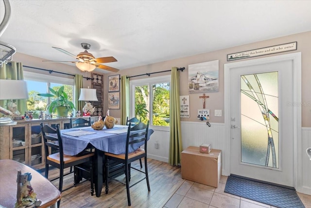 dining area featuring ceiling fan and light tile patterned flooring