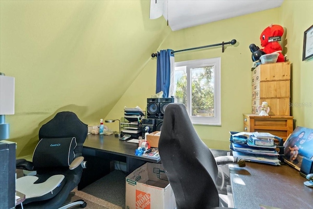 office space featuring carpet flooring and vaulted ceiling