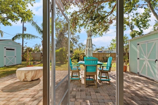 view of patio with a storage unit