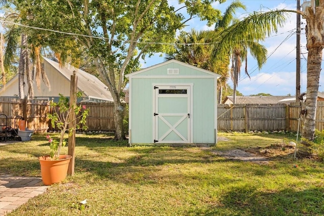 view of outbuilding featuring a yard