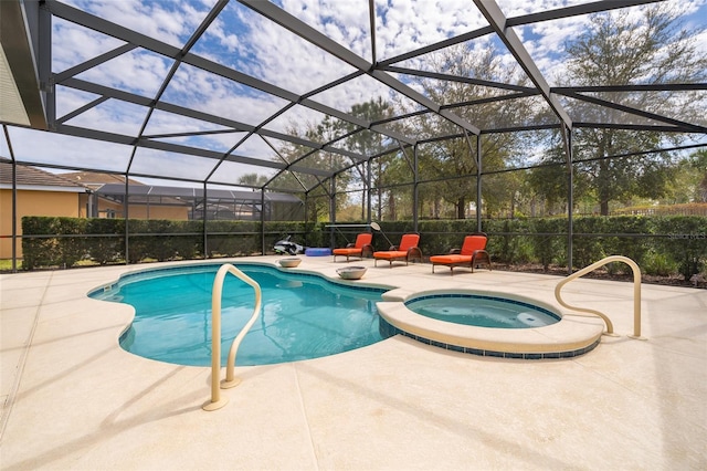 view of pool with an in ground hot tub, a patio area, and a lanai