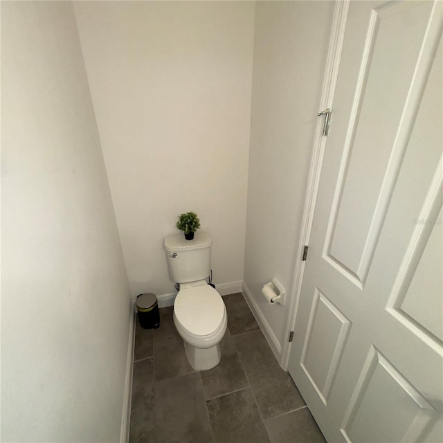 bathroom with tile patterned floors and toilet