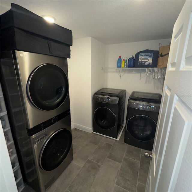 laundry room with stacked washer and clothes dryer