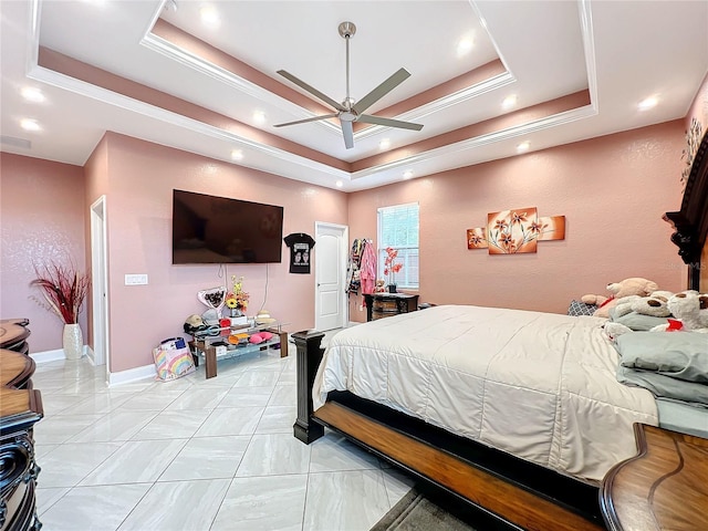 bedroom featuring a tray ceiling and ceiling fan