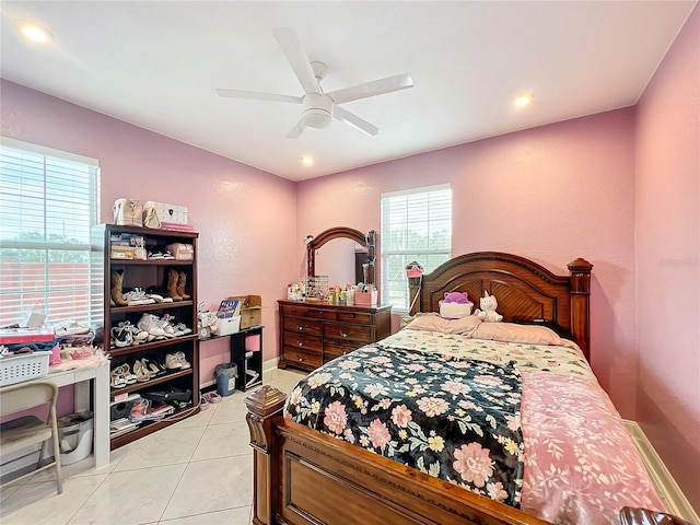 tiled bedroom with ceiling fan