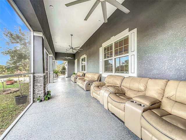 sunroom with ceiling fan