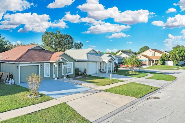 view of front facade featuring a garage and a front yard