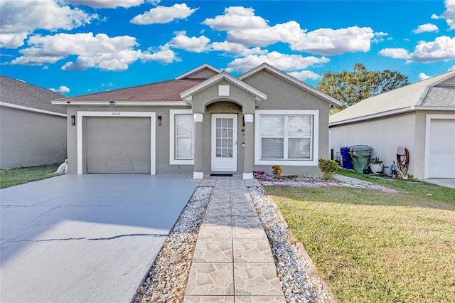 ranch-style house with a garage and a front yard