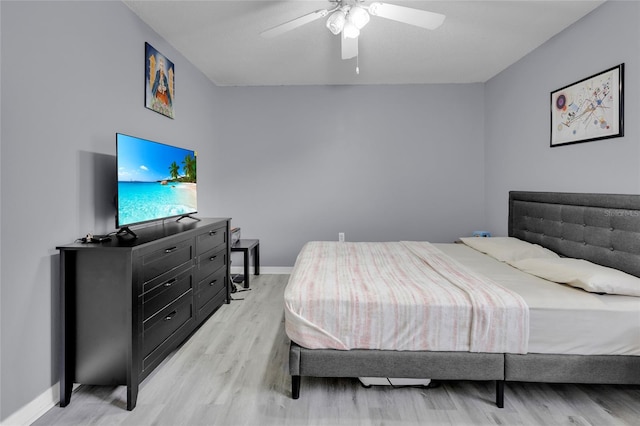 bedroom featuring light hardwood / wood-style flooring and ceiling fan