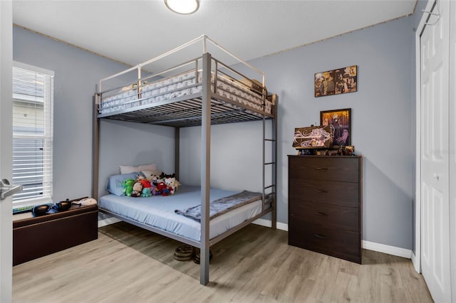 bedroom featuring wood-type flooring