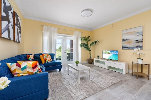 living room featuring light wood-type flooring and ornamental molding