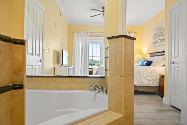 bathroom with a bathing tub, hardwood / wood-style flooring, ceiling fan, and crown molding