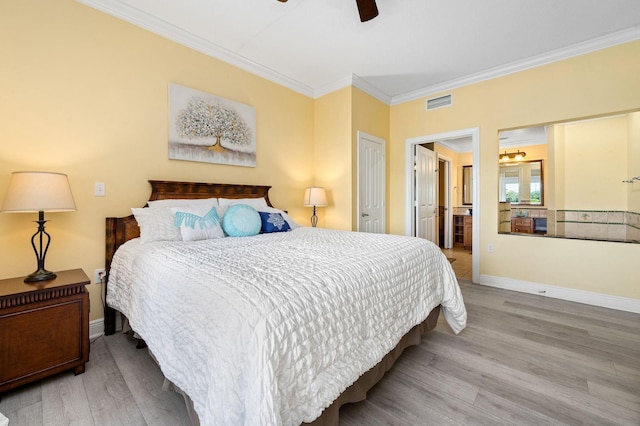 bedroom with ceiling fan, wood-type flooring, ornamental molding, and connected bathroom