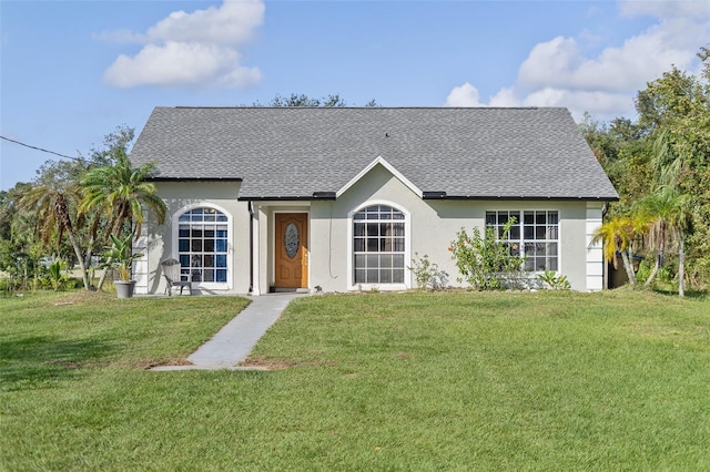 ranch-style house featuring a front lawn