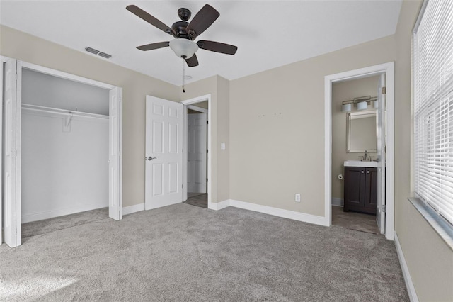 2108 Lemon St, Haines City, FL 33844 - unfurnished bedroom featuring carpet, a sink, a closet, ensuite bath, and baseboards