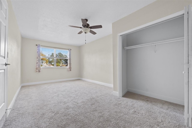 2108 Lemon St, Haines City, FL 33844 - unfurnished bedroom featuring carpet, a closet, a ceiling fan, and baseboards