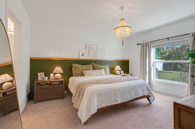 356 Citrine Loop, Kissimmee, FL 34758 - bedroom featuring light colored carpet and a chandelier
