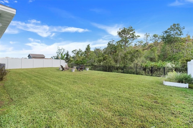 356 Citrine Loop, Kissimmee, FL 34758 - fenced yard with a fire pit