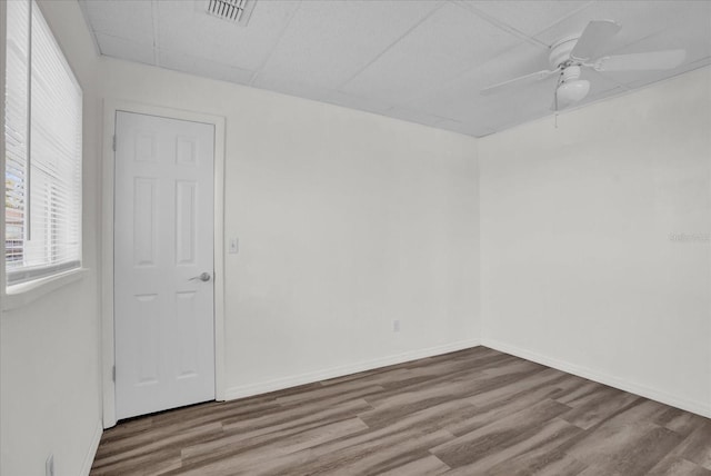 empty room featuring ceiling fan and wood-type flooring