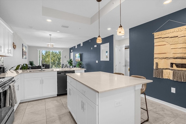 kitchen with kitchen peninsula, dishwasher, a kitchen island, white cabinets, and sink