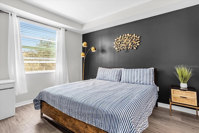 bedroom with wood-type flooring