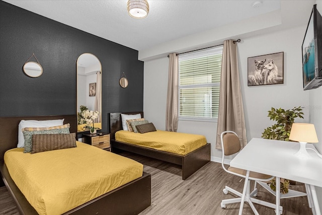 bedroom with wood-type flooring