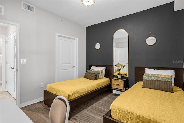 bedroom featuring hardwood / wood-style floors