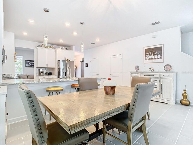 dining room featuring light tile patterned flooring