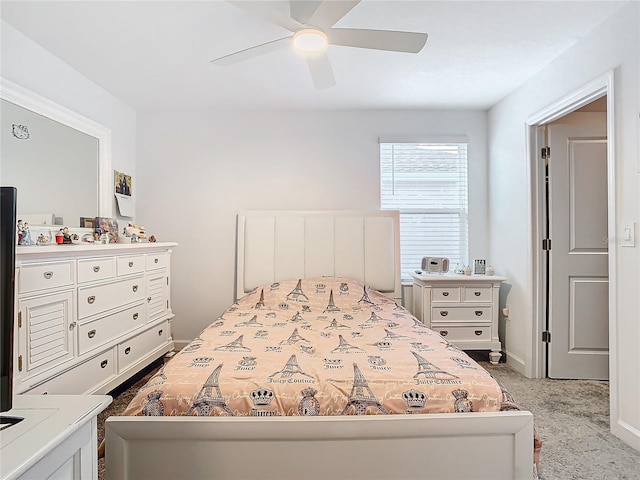 bedroom featuring carpet floors, a ceiling fan, and baseboards