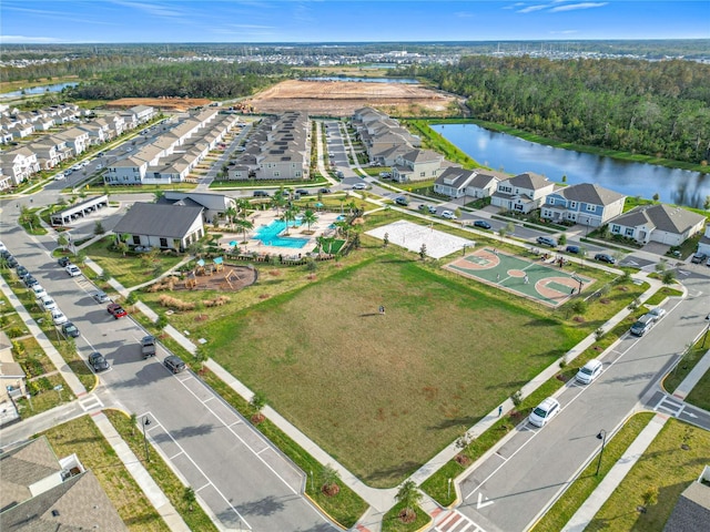 aerial view featuring a residential view and a water view