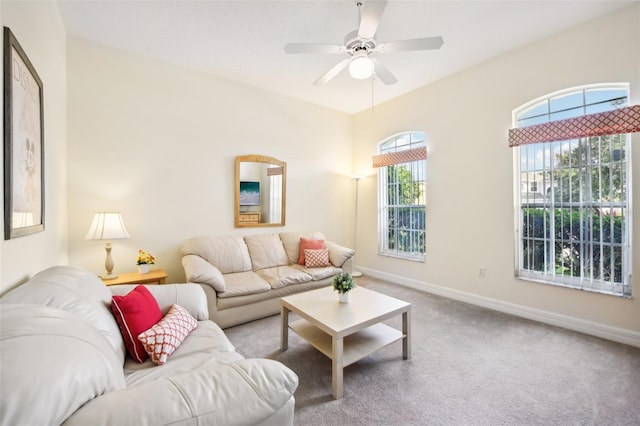 carpeted living room featuring ceiling fan and a healthy amount of sunlight