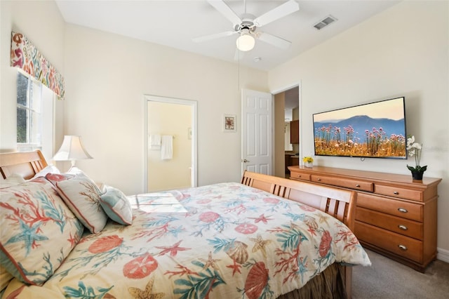 bedroom featuring carpet flooring, ceiling fan, and ensuite bath