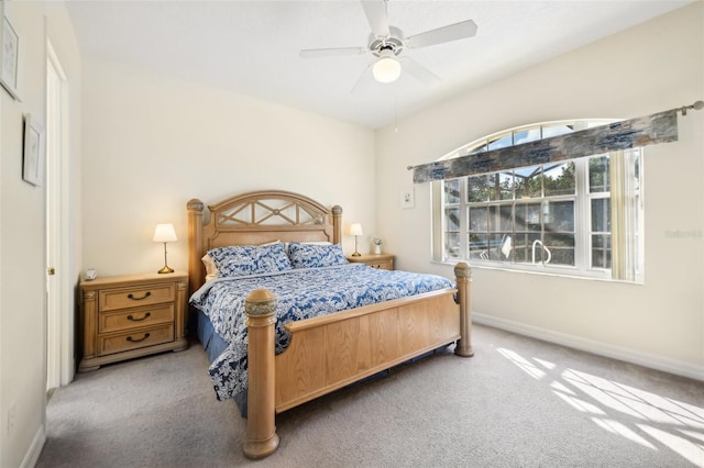 bedroom with ceiling fan and carpet floors