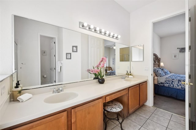 bathroom featuring tile patterned flooring and vanity