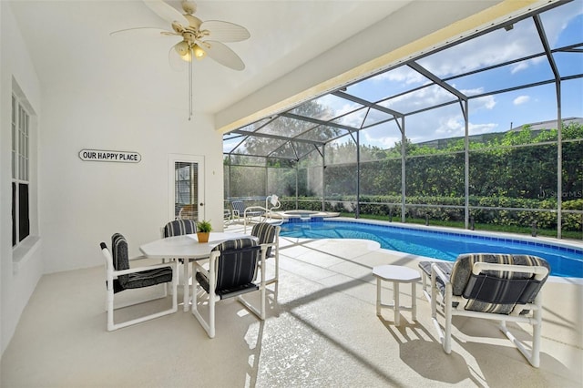 view of pool featuring an in ground hot tub, a patio, ceiling fan, and a lanai