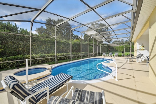 view of swimming pool with an in ground hot tub, a patio, and a lanai