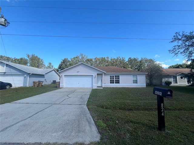 single story home featuring a garage and a front lawn