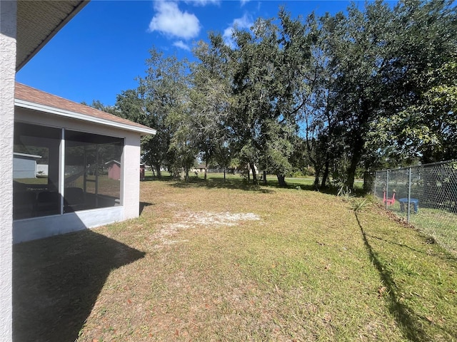 view of yard with a sunroom