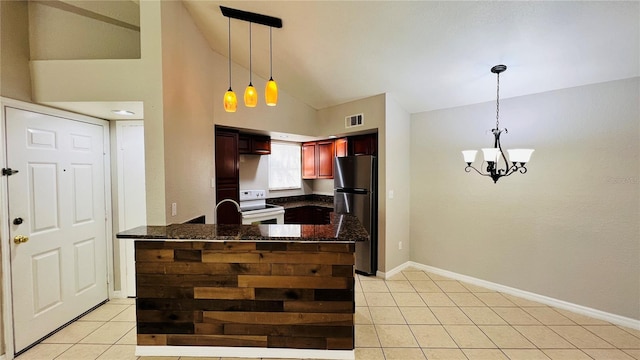 kitchen featuring hanging light fixtures, high vaulted ceiling, white range with electric cooktop, stainless steel fridge, and light tile patterned floors