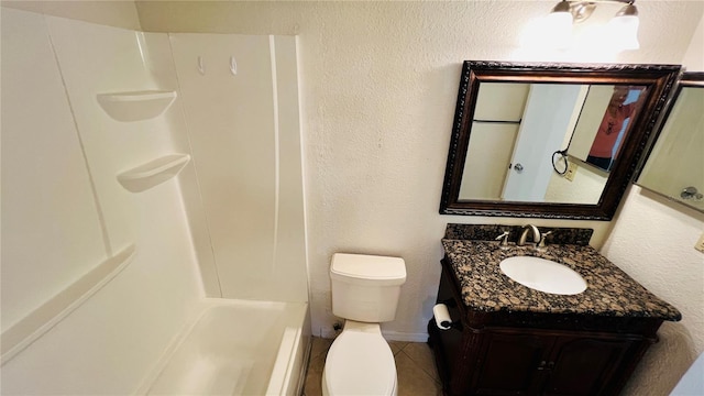 bathroom featuring tile patterned floors, vanity, and toilet