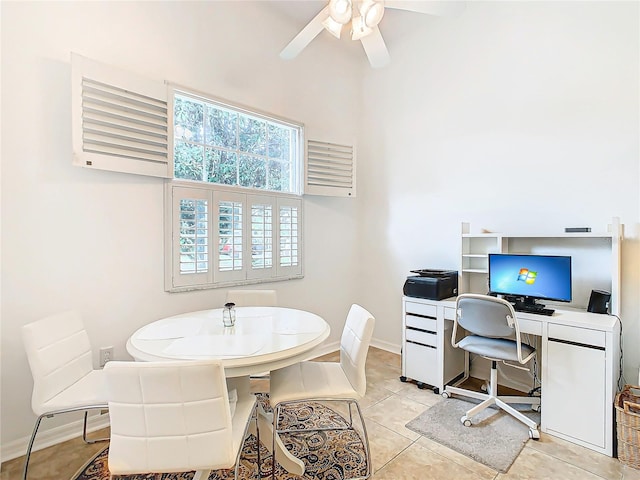 tiled office featuring ceiling fan