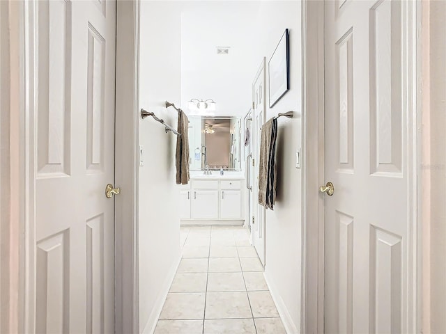 hallway with light tile patterned floors