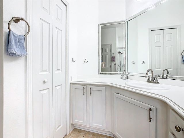 bathroom with tile patterned flooring and vanity